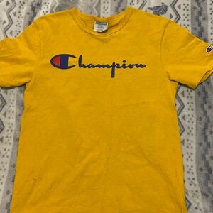 Yellow small champion shirt. It’s listed as a small but is perfect for meduim